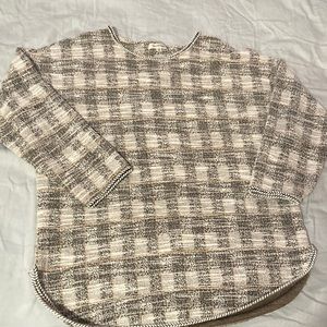 Black/white plaid top with streaks of mustard